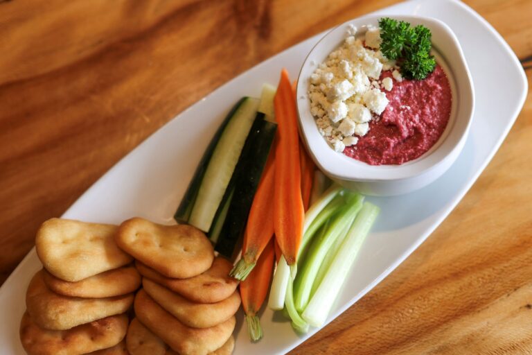 Beet Hummus - Roasted Beets, Tahini, Chickpeas, Feta Cheese, Fried Pita, Cucumber, Celery, Carrots, & Peppers
