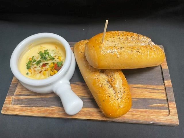 DBK Dip - DBK Brisket & Beef Blend, Queso, Pepper Jack, Corn Salsa, Peppadews, Toasted Cuban Bread