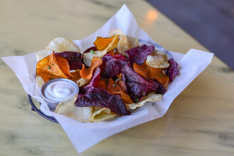 District Chips - A Collection of Hand cut Idahoan, Sweet, & Purple Peruvian Potatoes. Served with Malt Vinegar Aioli