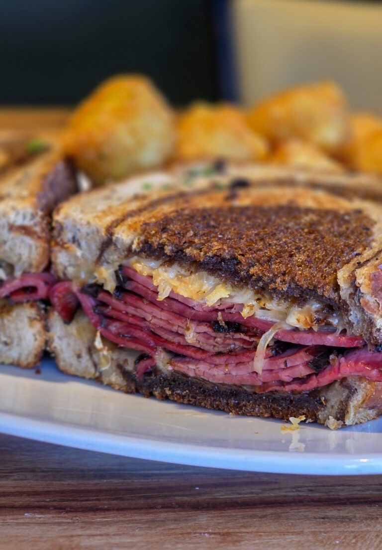 Boradway Reuben with tots close up of meat