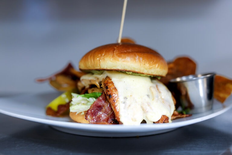 Chicken BLAT - Chicken Breast, White American Cheese, Bacon, Iceberg Lettuce, Avocado Mousse, Fried Green Tomatoes, Brioche Bun